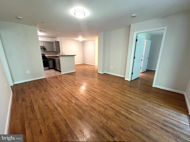 18815 Sparkling Water Dr Unit 4-O, Germantown, MD 20874 - unfurnished living room with wood finished floors and baseboards