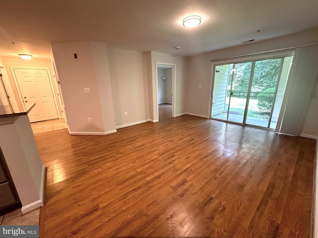 18815 Sparkling Water Dr Unit 4-O, Germantown, MD 20874 - spare room with wood finished floors and baseboards