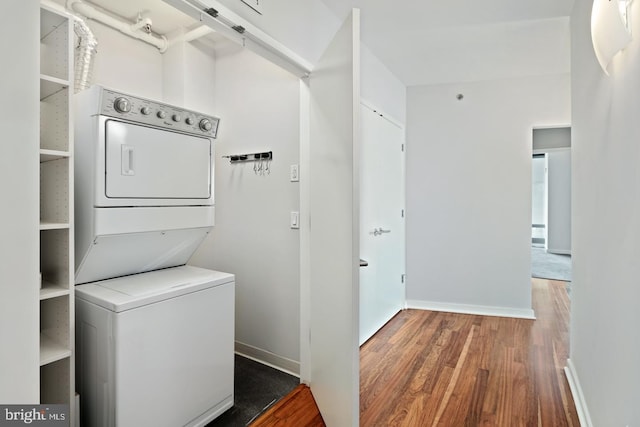 2101 Market St Unit 1902, Philadelphia, PA 19103 - washroom with stacked washer / drying machine and wood finished floors