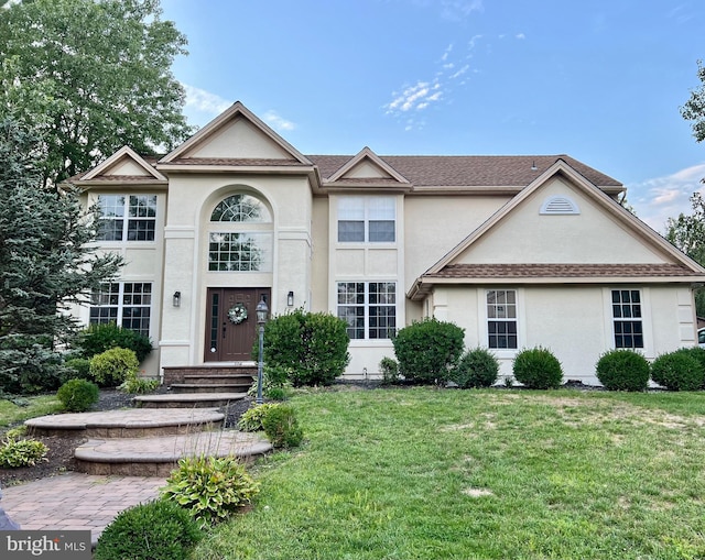 404 Harvest Mill Way, Mullica Hill, NJ 08062 - view of front facade with a front lawn and stucco siding