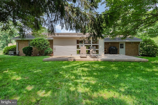 114 Brookside Ave, Hershey, PA 17033 - back of house with a patio area, brick siding, and a lawn