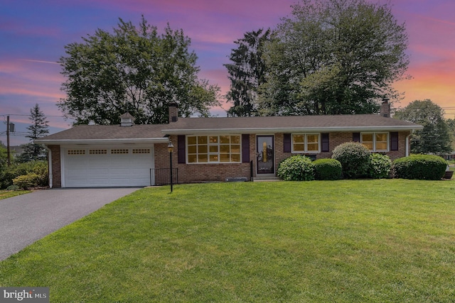 114 Brookside Ave, Hershey, PA 17033 - view of front of home featuring a chimney, a garage, driveway, and brick siding