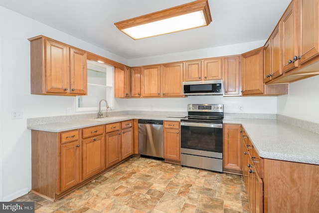 114 Brookside Ave, Hershey, PA 17033 - kitchen with stainless steel appliances, stone finish flooring, light countertops, and brown cabinets