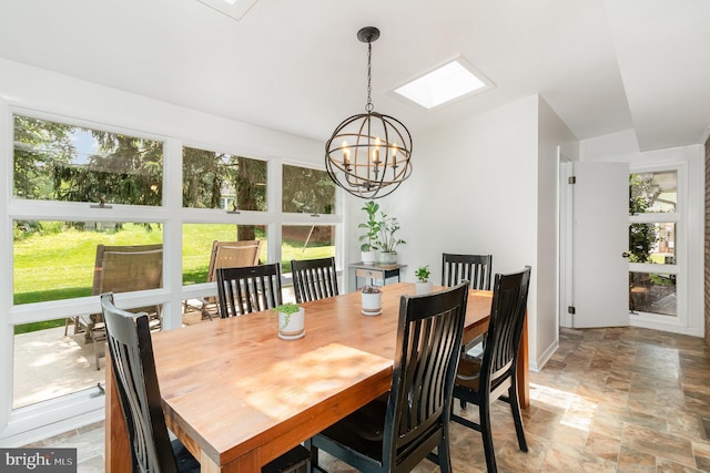 114 Brookside Ave, Hershey, PA 17033 - dining area featuring light stone finish floors, a chandelier, and a skylight