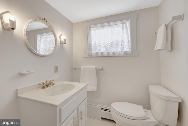 1012 Grant St, Herndon, VA 20170 - half bathroom with vanity, tile patterned floors, and a baseboard radiator