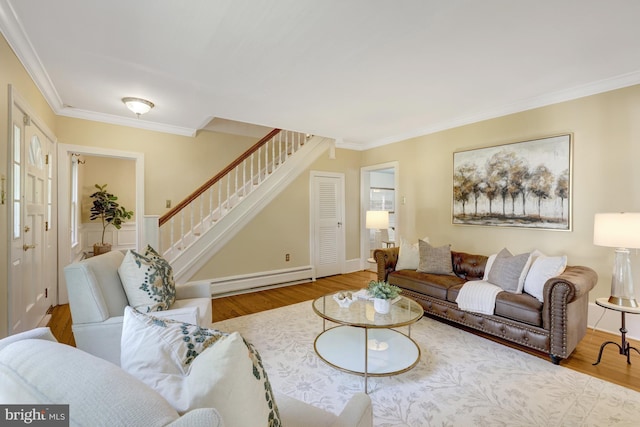 1012 Grant St, Herndon, VA 20170 - living area featuring a baseboard radiator, wood finished floors, stairs, and crown molding