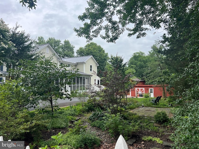 1012 Grant St, Herndon, VA 20170 - view of yard featuring a sunroom and an outdoor structure