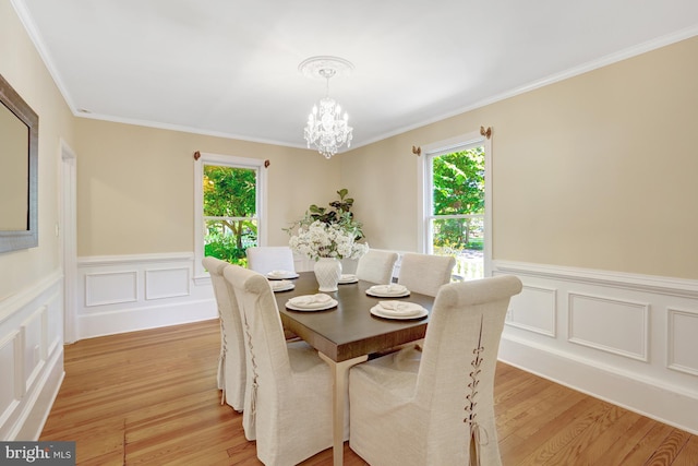 1012 Grant St, Herndon, VA 20170 - dining room with plenty of natural light, a chandelier, light wood-style floors, ornamental molding, and a wainscoted wall