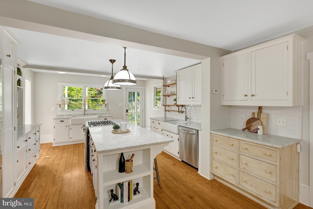 1012 Grant St, Herndon, VA 20170 - kitchen featuring open shelves, appliances with stainless steel finishes, and light wood-style flooring