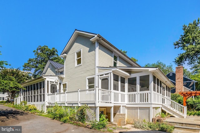 1012 Grant St, Herndon, VA 20170 - back of property featuring a sunroom and stairs