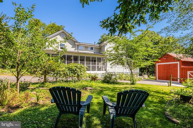1012 Grant St, Herndon, VA 20170 - view of grassy yard with a sunroom and an outdoor structure