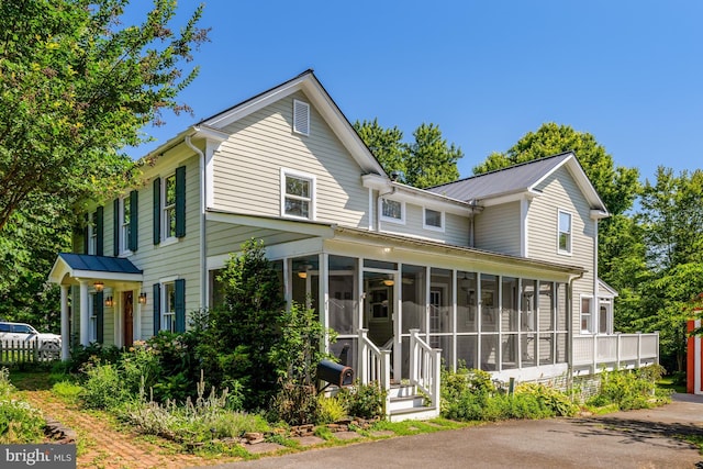 1012 Grant St, Herndon, VA 20170 - back of house with a sunroom and a metal roof
