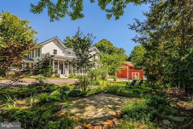 1012 Grant St, Herndon, VA 20170 - view of yard with an outbuilding, a sunroom, and a barn