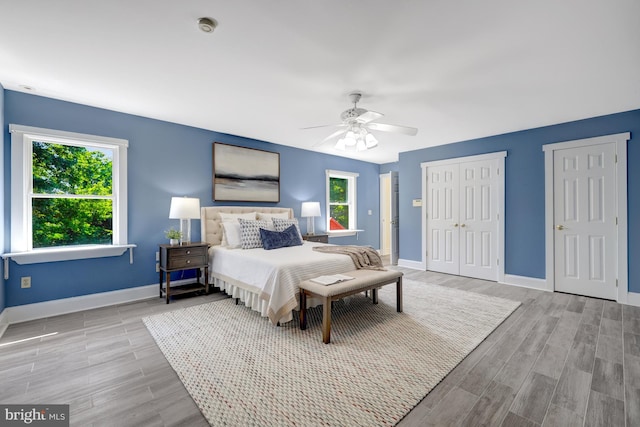 1012 Grant St, Herndon, VA 20170 - bedroom featuring two closets, wood finished floors, and ceiling fan