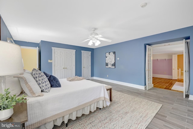 1012 Grant St, Herndon, VA 20170 - bedroom featuring light wood finished floors, multiple closets, and a ceiling fan