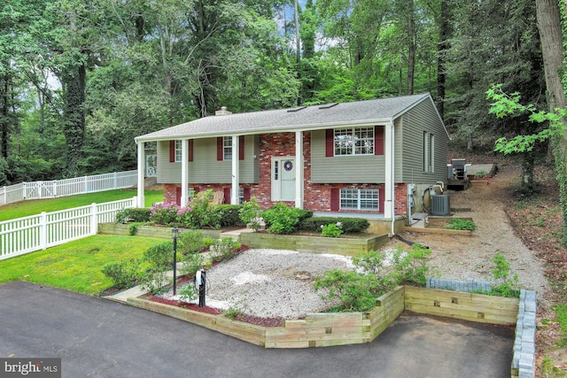 47 Sheridan Rd, Arnold, MD 21012 - split foyer home featuring brick siding and a chimney