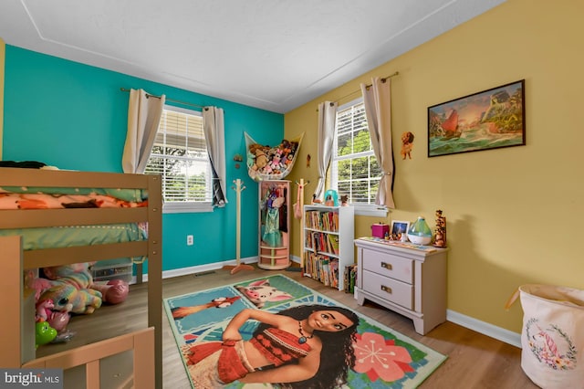 47 Sheridan Rd, Arnold, MD 21012 - bedroom featuring multiple windows and wood finished floors
