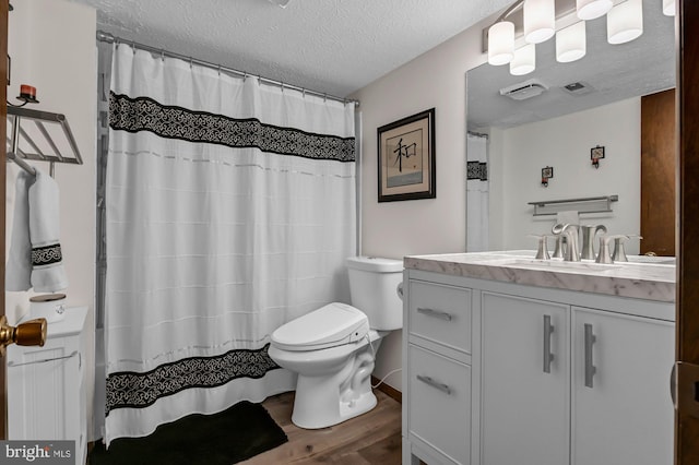 47 Sheridan Rd, Arnold, MD 21012 - full bath featuring wood finished floors, vanity, a textured ceiling, and curtained shower