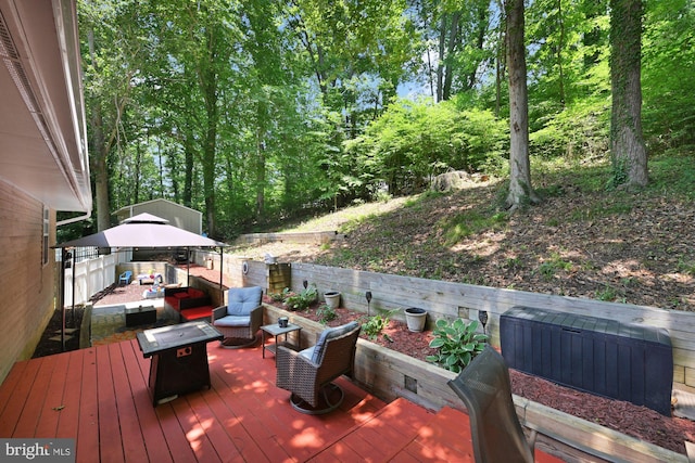47 Sheridan Rd, Arnold, MD 21012 - wooden deck featuring a gazebo and an outdoor living space with a fire pit