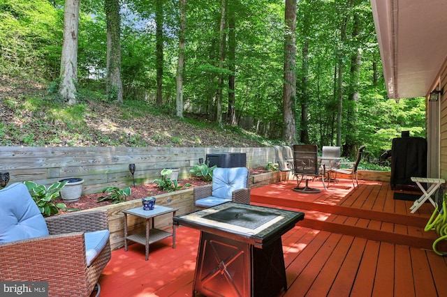 47 Sheridan Rd, Arnold, MD 21012 - wooden terrace with outdoor dining space and a fire pit