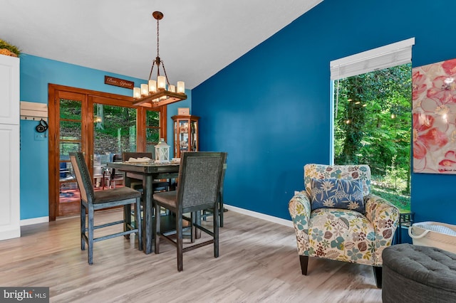 47 Sheridan Rd, Arnold, MD 21012 - dining room with a chandelier, light wood finished floors, plenty of natural light, and vaulted ceiling