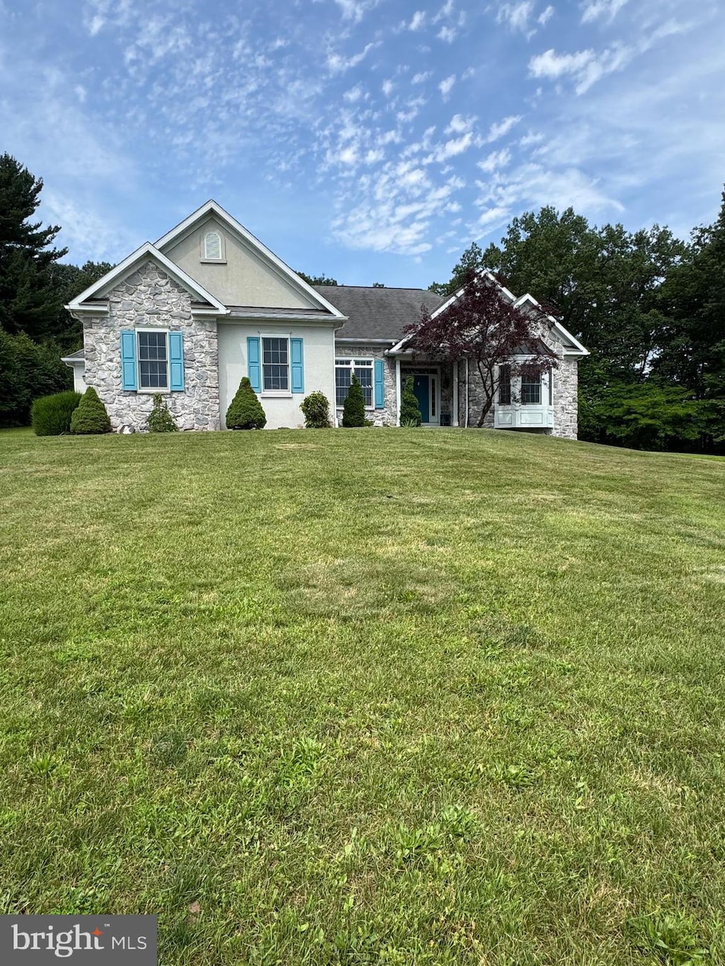 2219 Morgantown Rd, Reading, PA 19607 - ranch-style house with stone siding, a front yard, and stucco siding