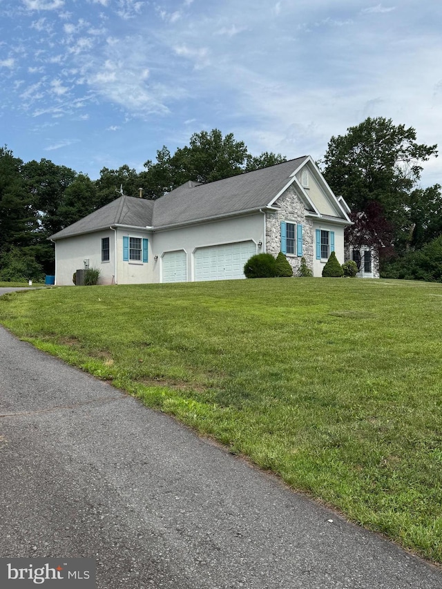 2219 Morgantown Rd, Reading, PA 19607 - ranch-style house with stone siding, a front yard, a garage, and stucco siding