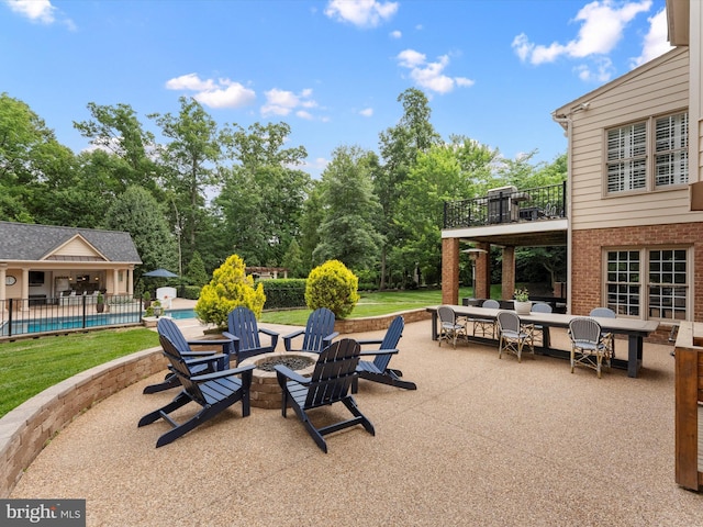 13412 Ellerton Ct, Midlothian, VA 23113 - patio / terrace featuring a patio area, an outdoor pool, an outdoor fire pit, and view of wooded area