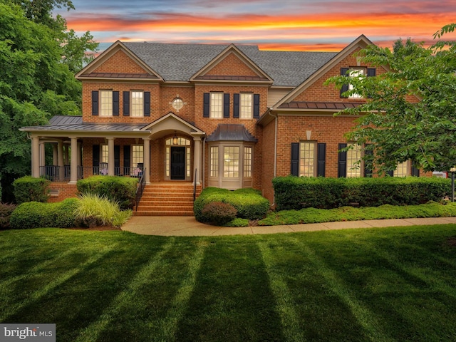 13412 Ellerton Ct, Midlothian, VA 23113 - colonial-style house with a standing seam roof, brick siding, a front yard, and a shingled roof