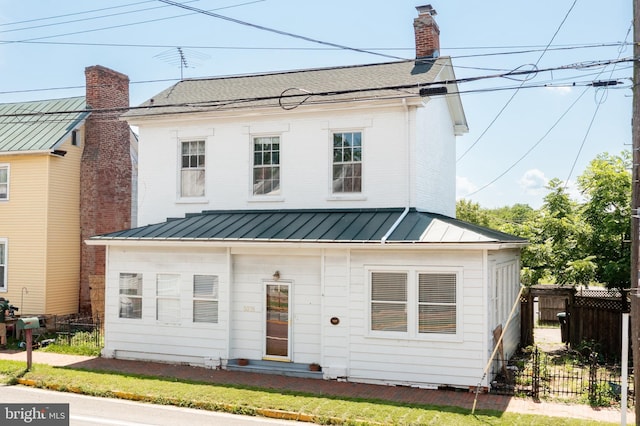 5378 Main St, Stephens City, VA 22655 - view of front of house featuring a standing seam roof, a metal roof, and a chimney