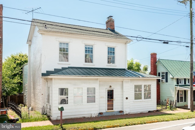 5378 Main St, Stephens City, VA 22655 - view of front facade with a standing seam roof, a chimney, and a metal roof