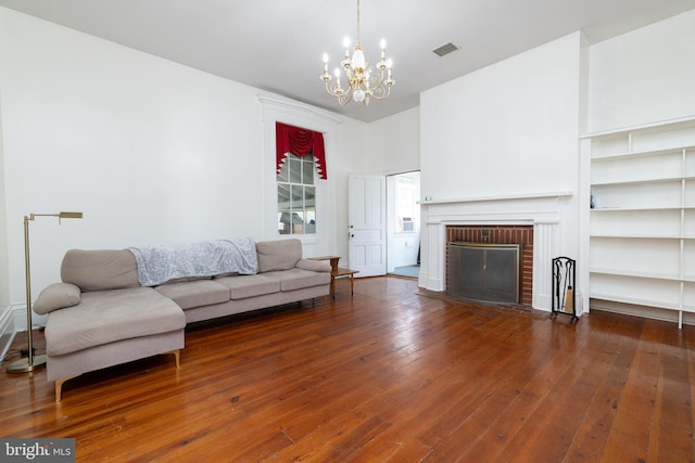 5378 Main St, Stephens City, VA 22655 - living area with a chandelier, wood-type flooring, and a fireplace