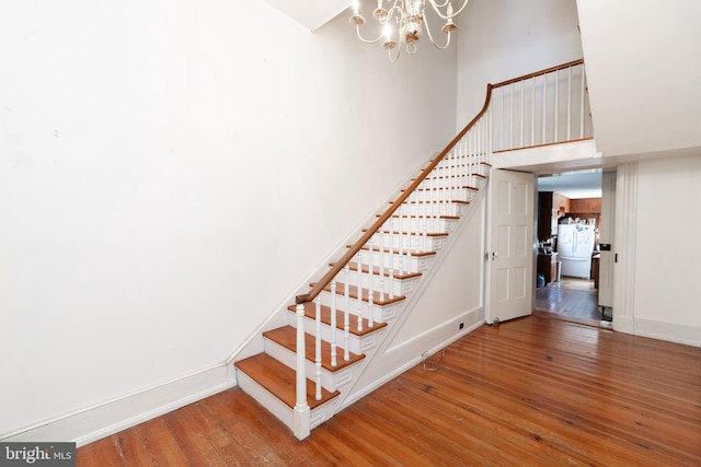 5378 Main St, Stephens City, VA 22655 - stairway featuring hardwood / wood-style flooring and a chandelier