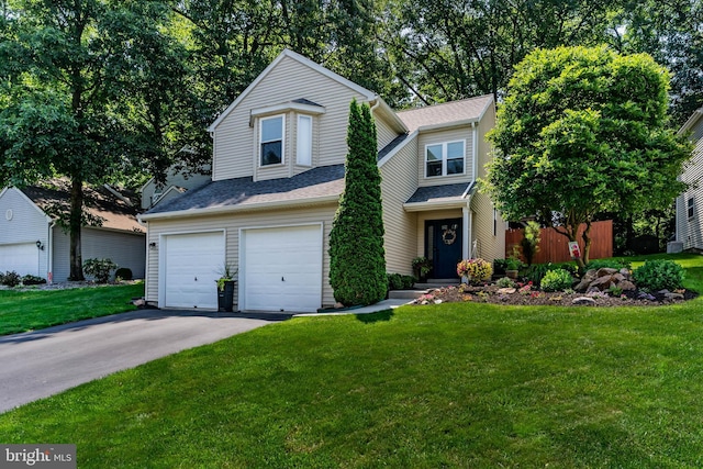 6111 Summit Pointe Dr, Harrisburg, PA 17111 - traditional-style home with asphalt driveway, a garage, and roof with shingles