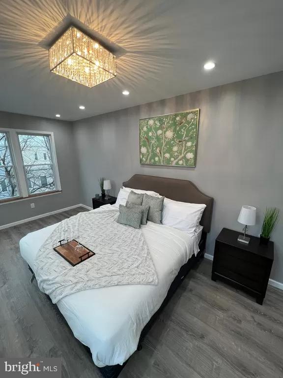 2057 N Franklin St, Philadelphia, PA 19122 - bedroom featuring wood finished floors, a chandelier, and recessed lighting