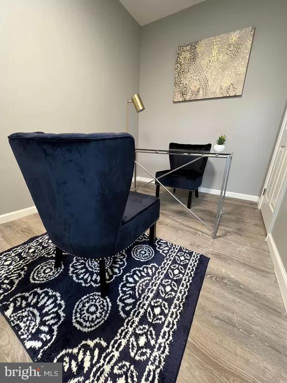 2057 N Franklin St, Philadelphia, PA 19122 - sitting room featuring wood finished floors and baseboards