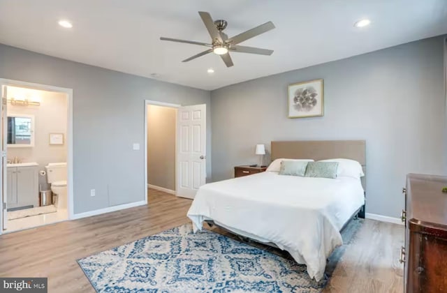 2057 N Franklin St, Philadelphia, PA 19122 - bedroom with wood finished floors, ensuite bathroom, recessed lighting, and a ceiling fan