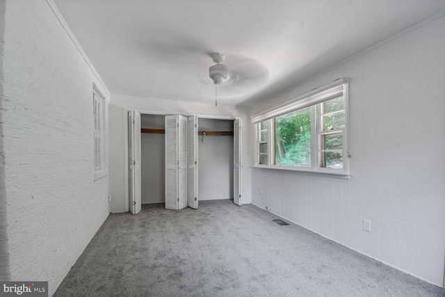 1627 Myrtle St NW, Washington, DC 20012 - unfurnished bedroom with two closets, carpet, and a ceiling fan
