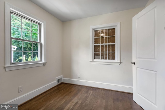 1627 Myrtle St NW, Washington, DC 20012 - unfurnished room featuring baseboards and dark wood-style flooring