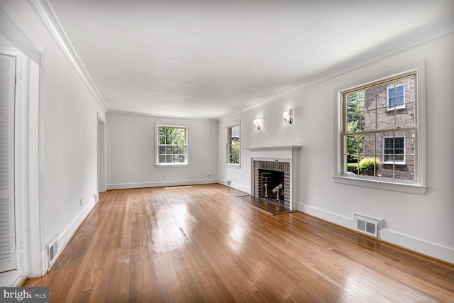 1627 Myrtle St NW, Washington, DC 20012 - unfurnished living room featuring ornamental molding, wood finished floors, and a brick fireplace