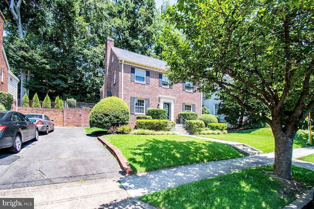 1627 Myrtle St NW, Washington, DC 20012 - colonial home featuring a chimney and brick siding