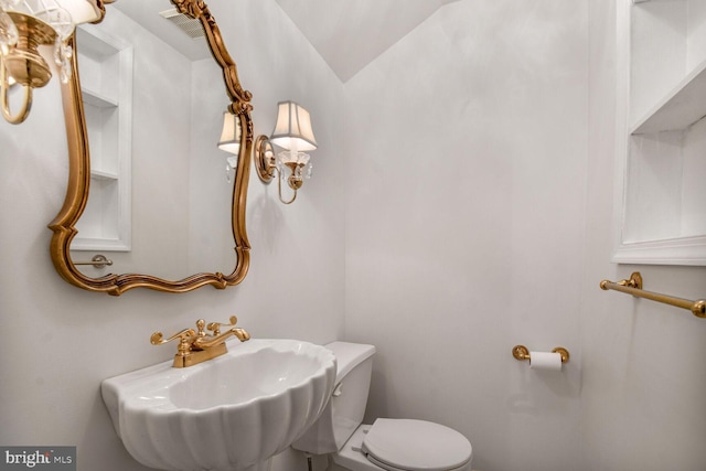 1627 Myrtle St NW, Washington, DC 20012 - half bath with a sink and vaulted ceiling