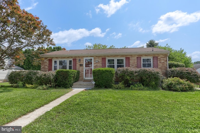 616 S 6th St, Lebanon, PA 17042 - view of front of house featuring a front lawn and brick siding