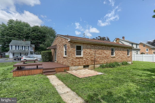 616 S 6th St, Lebanon, PA 17042 - rear view of property with a deck, brick siding, and a chimney