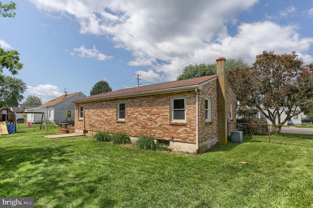 616 S 6th St, Lebanon, PA 17042 - rear view of property featuring brick siding and a chimney