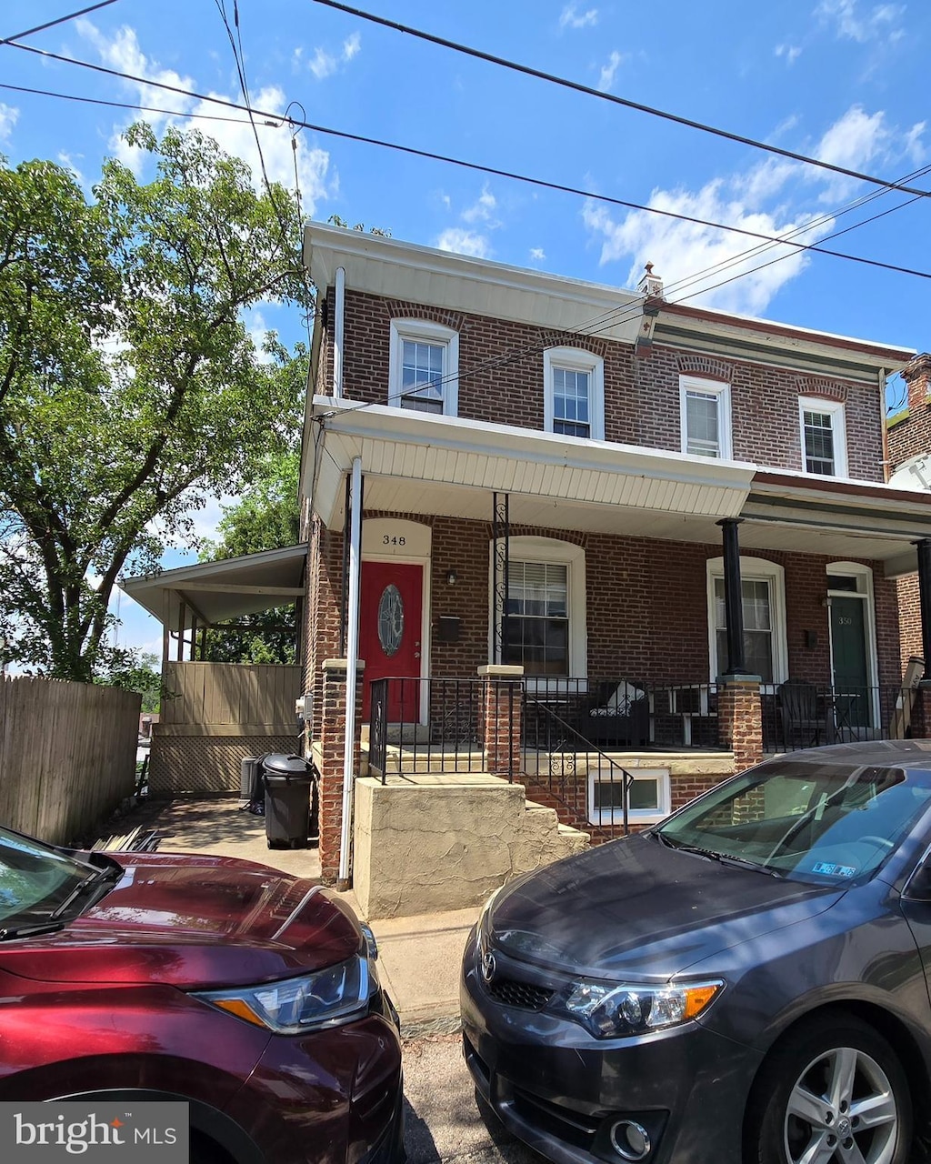 348 Dupont St, Philadelphia, PA 19128 - townhome / multi-family property with brick siding and covered porch