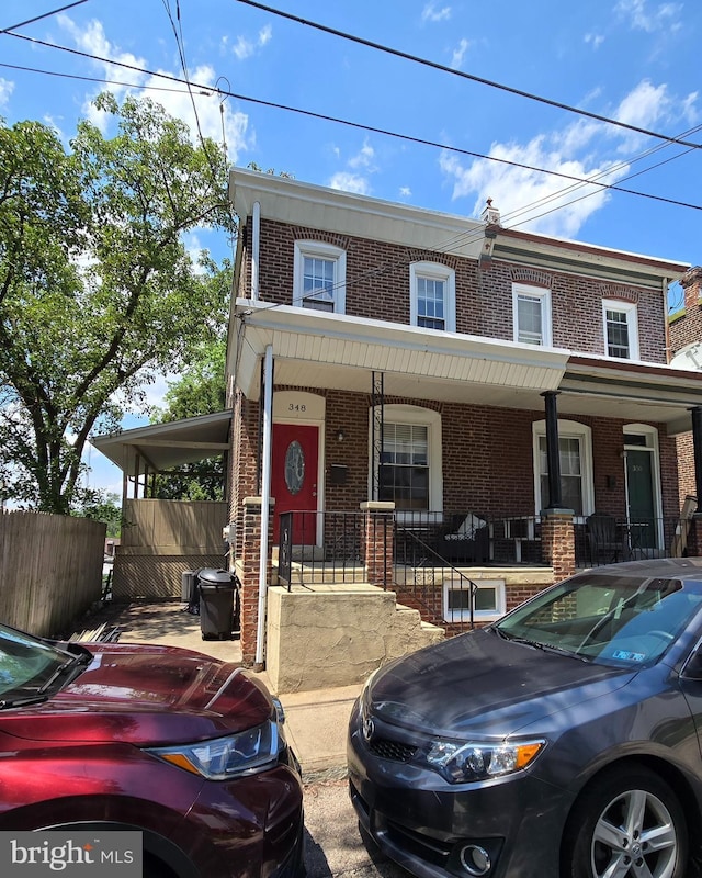 348 Dupont St, Philadelphia, PA 19128 - townhome / multi-family property with brick siding and covered porch