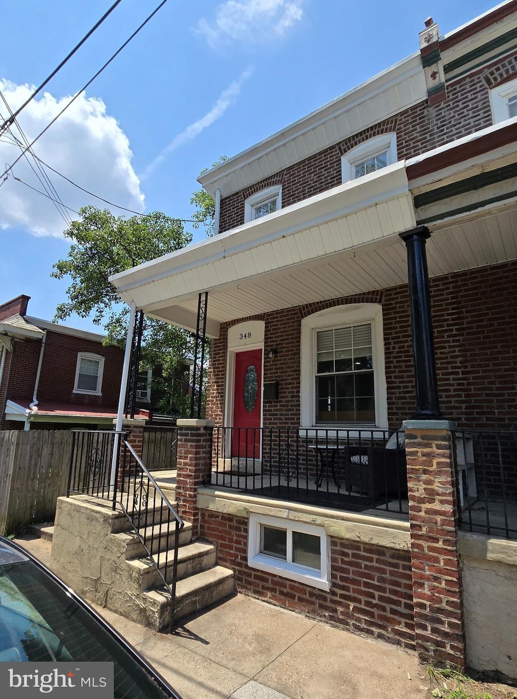 348 Dupont St, Philadelphia, PA 19128 - view of front of home featuring covered porch and brick siding