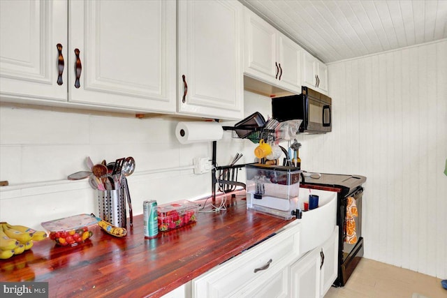 643 Penn, West Reading, PA 19611 - kitchen featuring black appliances, white cabinets, butcher block countertops, and wooden ceiling