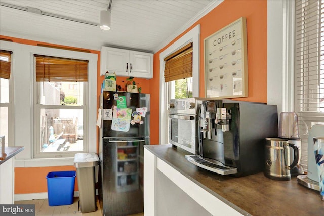 643 Penn, West Reading, PA 19611 - kitchen featuring freestanding refrigerator, dark countertops, and white cabinets
